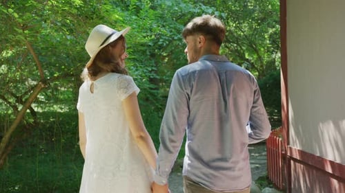 Rear view of a couple walking