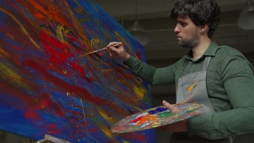 Painter Working on Abstract Painting in Studio