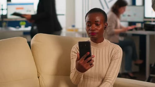Woman on Video Call in Modern Office Setting