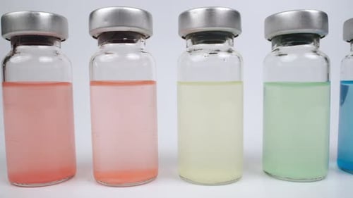 Vials with different colored liquids in laboratory