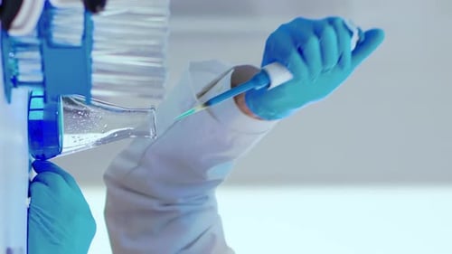 Pipette Extracting Fluid in Medical Lab Close Up