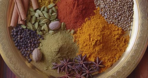 Colorful Spices on a Decorative Golden Plate