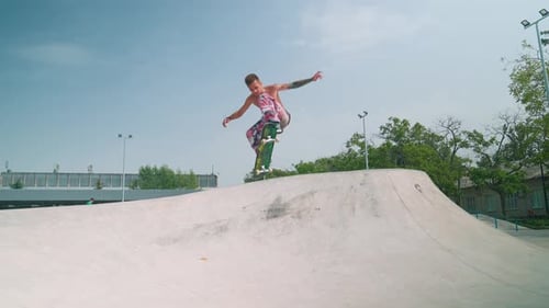 Skateboarder Executes Trick in an Urban Skate Park