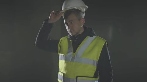Man Wearing Hard Hat and Yellow Vest