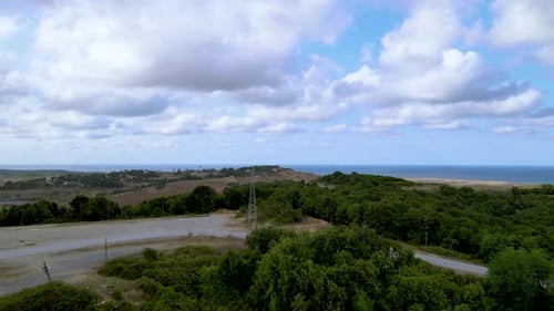 Drone flight over the north Istanbul forest. Cloudy sky, blue sea and green nature