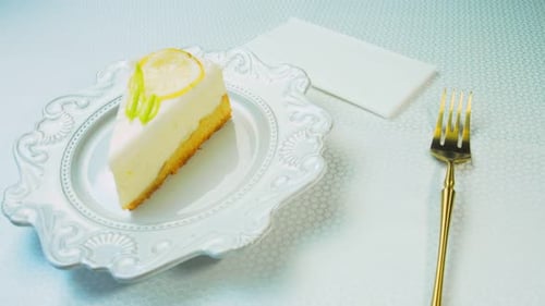 Delicious Slice of Lemon Cake on a White Plate
