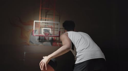 Slowmo of Player Shooting Basketball into Hoop