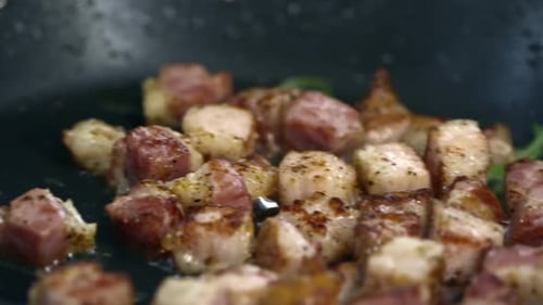Chopped Bacon Frying in Olive Oil