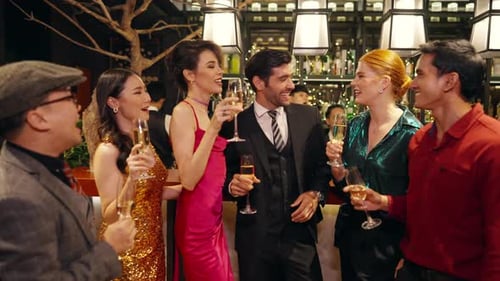 4K Group of people celebrating holiday event with toasting champagne glasses together at luxury bar