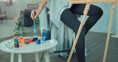 Female Artist Painting Indoors