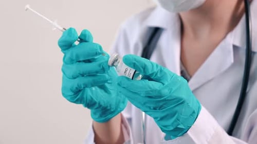 Medical Professional Preparing Vaccine for Injection