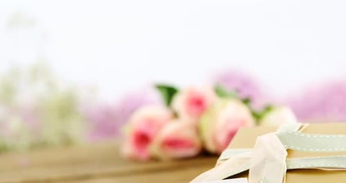 Still life gold gift on wooden table