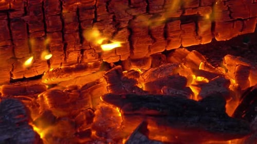 Glowing Embers in Burning Firewood Close Up