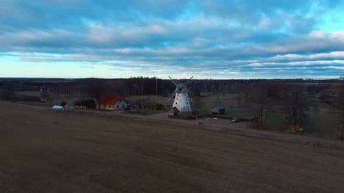 Old Araisi Windmill in Latvia Aerial Shot From Above. Winter Day at Sunrise 4K Video