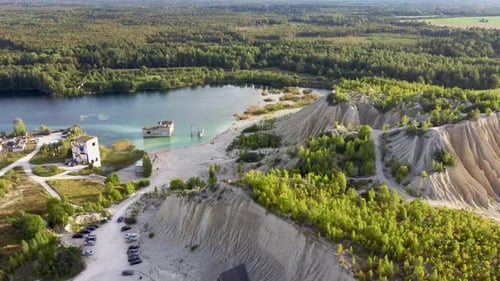 Sand Hills of Quarry with A Pond and Abandoned Prison in Rummu Estonia Europe. Aerial Dron Shoot