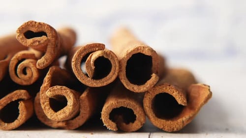 Detail Shot of Cinnamon Sticks on White