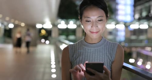 Business Woman Use of Mobile Phone in City