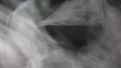 Abstract Smoke on black Background, Soft fog in slow motion on dark backdrop,