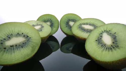 Sliced Kiwi Fruit on a Reflective Surface