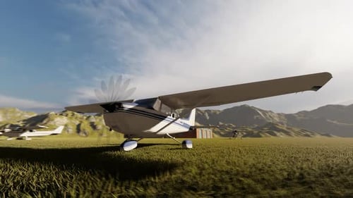 Small Propeller Plane on Grassy Airfield with Mountain Backdrop