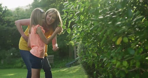 Senior Caucasian woman and her granddaughter spending time in garden