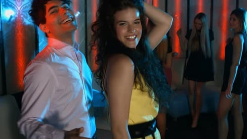 Smiling Young Adults Dancing at Nightclub Party