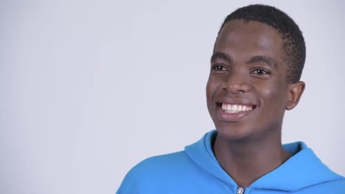 Face of Young Happy African Man Smiling and Thinking