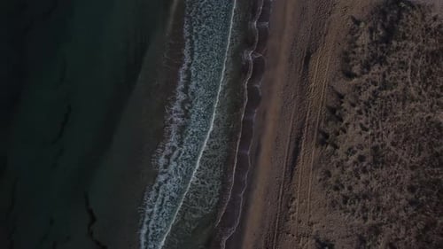 Beautiful Coastline with Waves Shooting From a Bird'seye View By Drone