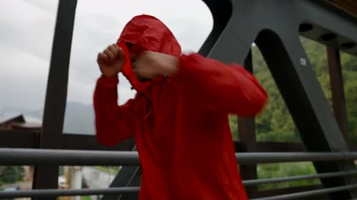 Hooded Man Shadow Boxing on Overcast Day