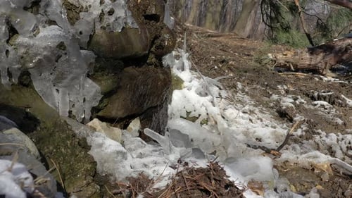 Man-made waterfall waters and icicles 4K video