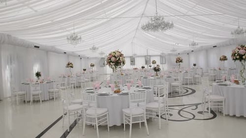 Elegant Wedding Reception Setup in a Bright Ballroom