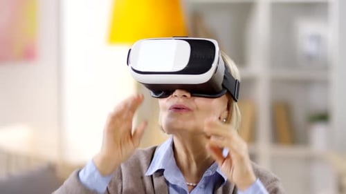 Senior Woman Tries Virtual Reality Headset Indoors