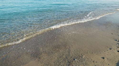 Beach with Sea and Calm Waves in Summer in Sicily