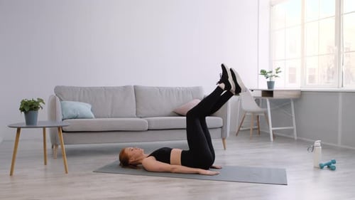 Woman Doing Leg Lifts at Home