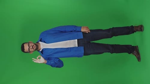 Young Adult Giving Okay Sign on Green Screen