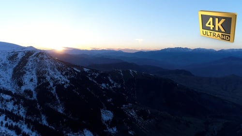 Aerial Shot Of Snowy Mountains During Sunrise 5