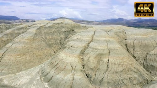 Drone Flight Over Layered Mountains Landscape