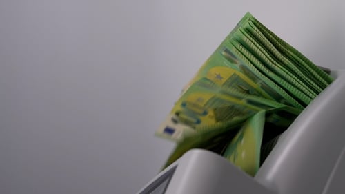 Money Counter Processing Stack of Euro Currency