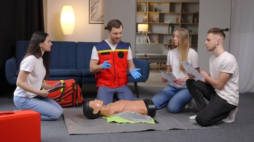 Adults Learn CPR Skills in a Training Class