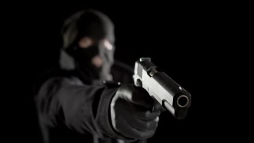 Figure in Ski Mask Fires Handgun in the Dark