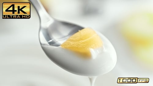 Pineapple Chunk in Yogurt Being Scooped up