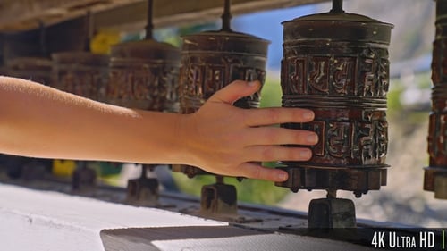 Hand Spinning Intricate Tibetan Prayer Wheels