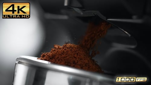 Ground Coffee Fills Portafilter with Espresso Grinds Close Up