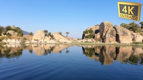 Calm Lake with Boulders Reflecting Natural Beauty