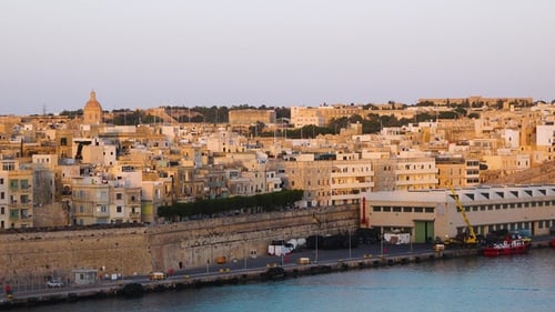 Exploring the stunning coastal views and historical architecture of Valletta, Malta at sunset.