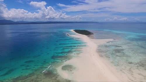 Beaches and islands of the Indian Ocean. Drone view of a tropical island and corral reef. Paradise.