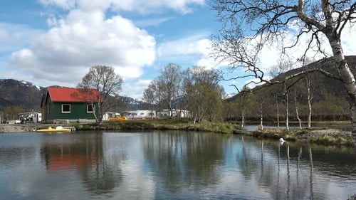 Scenic view of small fishing village with red houses. Traditional wooden old fishermen's houses.