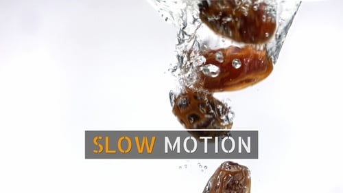 Dates Falling Into Water in a Close Up Shot