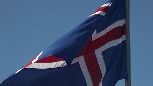 Icelandic flag flutters in the wind. Iceland national flag of european country.