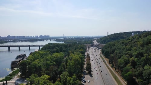 Aerial view of the vehicular intersection, traffic at peak hour with cars on the road, on the bridge